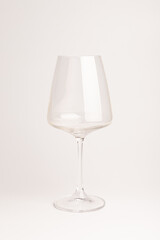 Empty transparent wine glass on the white background