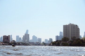 THAILAND, BANGKOK: Scenic cityscape view of architecture along the riverside with old traditional buildings and modern skyscrapers