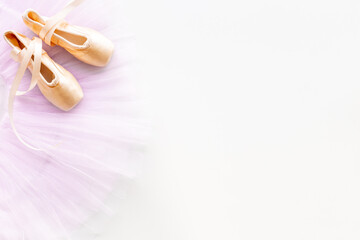 Used ballet pointe shoes on tutu skirt. Set for ballerina