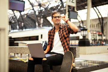 Fototapeta premium Man shopping online with laptop. Young man buying online with credit card