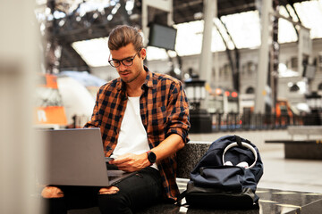 Man shopping online with laptop. Young man buying online with credit card