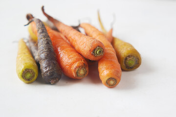  mixed colorful carrot on white background 