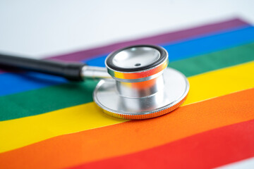 Black stethoscope on rainbow flag background, symbol of LGBT pride month  celebrate annual in June social, symbol of gay, lesbian, bisexual, transgender, human rights and peace.