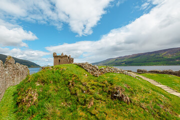 Fototapeta na wymiar Urquhart Castle beside Loch Ness in Scotland, United Kingdom. Close to Drumnadrochit and Inverness. It's one of the most visited castles for the legend of the Loch Ness monster: Nessie.