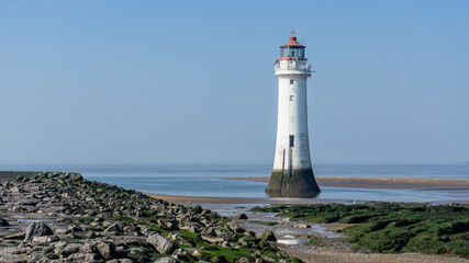 Fototapeta na wymiar The lighthouse at low tide