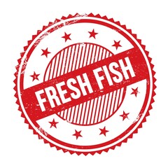 FRESH FISH text written on red grungy round stamp.