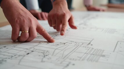 Hands engineers in shot on drawing table. They point their fingers at the blueprint. Engineers team discussing together with blueprint on the drawing table for planning the work in the industrial - Powered by Adobe
