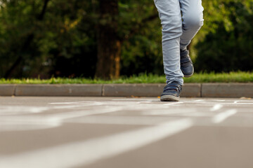 Kids playing hopscotch on playground outdoors. Hopscotch popular street game.