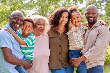 Portrait Of Smiling Multi-Generation Family At Home In Garden Together