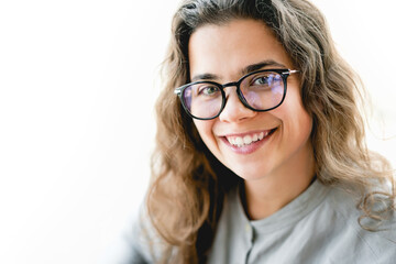 Obraz premium Portrait of young confident caucasian businesswoman in eyeglasses looking at the camera smiling. Entrepreneurship for better quality of life, isolated