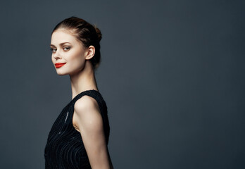 woman in black dress red lips posing luxury passion attractive look