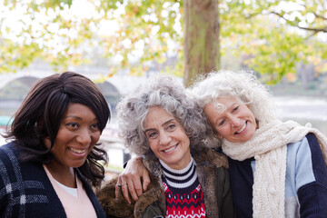 Portrait smiling, happy active senior women friends at autumn park