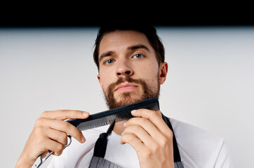 man in apron barbershop haircut provision of services