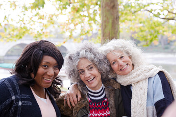 Portrait smiling, happy active senior women friends at autumn park