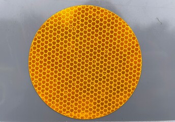 Yellow reflective honeycomb attached to the wall