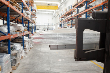 Pallets and equipment on shelves in warehouse
