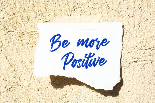 Be More Positive write on Sticky Notes. Motivation conceptual Image