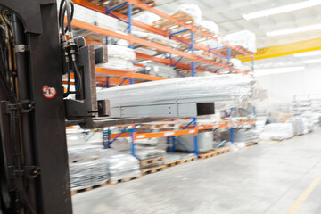 Pallets and equipment on shelves in warehouse