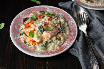 ptitim pasta with shrimp, dried tomatoes, spinach