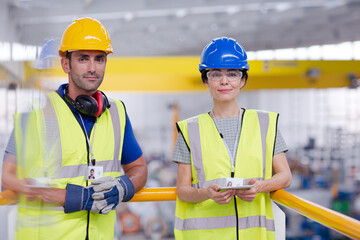 Supervisor and worker in steel factory