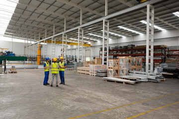 Supervisor and workers talking in warehouse
