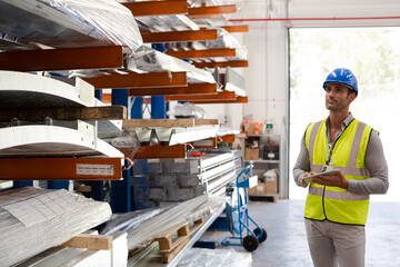 Fototapeta premium Male worker using digital tablet in steel factory