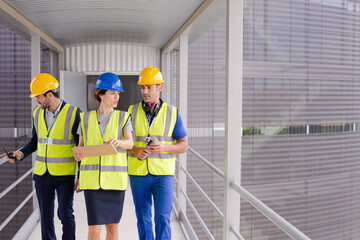 Supervisors and worker in steel factory
