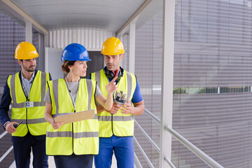 Supervisors and worker in steel factory