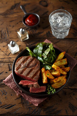 Beef steak with roasted potato and salad