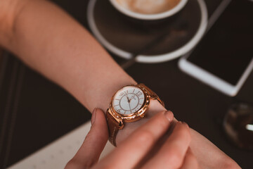 Close up of female hands with stylish watch