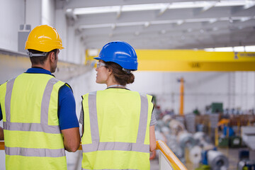 Supervisor and worker in factory