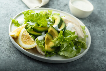 Healthy green salad with chicken and avocado