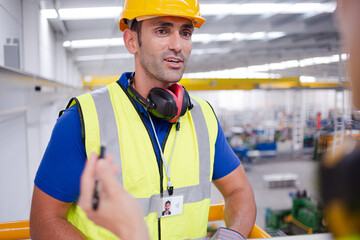 Portrait confident worker in steel factory