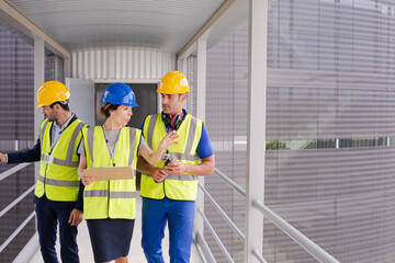Supervisors and worker in steel factory