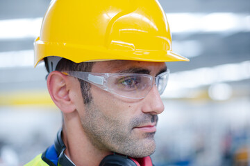 Portrait confident male worker in factory