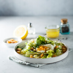 Green salad with egg and bread croutons