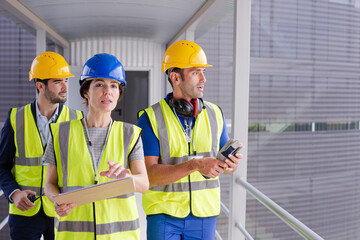 Supervisors and worker in steel factory