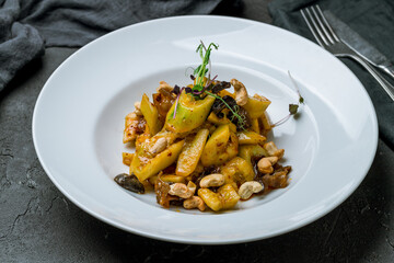 cucumbers sour and spicy with cashews chinese cuisine on dark stone table