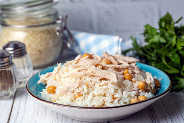 Traditional delicious Turkish food; Rice with chickpeas and chicken (Turkish name; Tavuklu nohutlu pilav or pilaf)