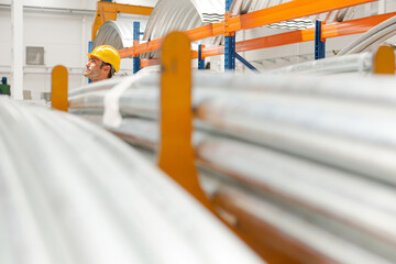 Naklejka premium Male worker looking up in factory