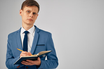 manager with notepad in hand documents work official