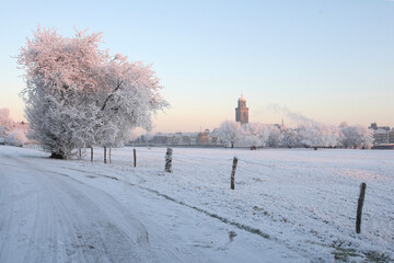 View on the city of Deventer, the Netherlands, on a cold day in winter with snow and frost