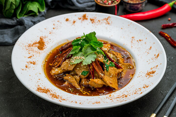 South China Fried Meat hot and spicy on black stone table