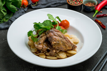 Lamb stewed with lima beans chinese cuisine on dark stone table