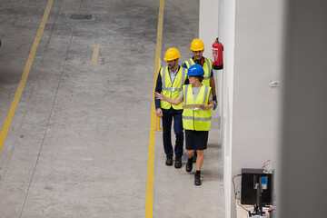 Supervisor and workers talking in factory