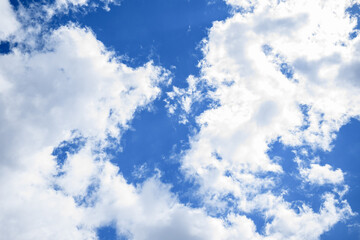 The fluffy clouds in the blue sky. Abstract background for design and project. Concept: ecology, weather