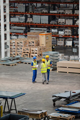 Fototapeta premium Workers and supervisor talking in factory