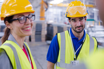 Workers talking in steel factory