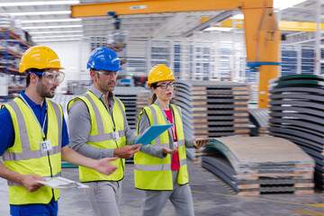 Supervisor and workers talking in warehouse