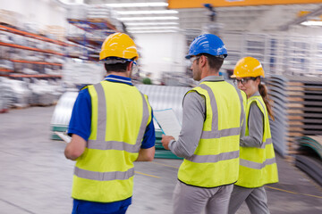 Supervisor and workers talking in warehouse
